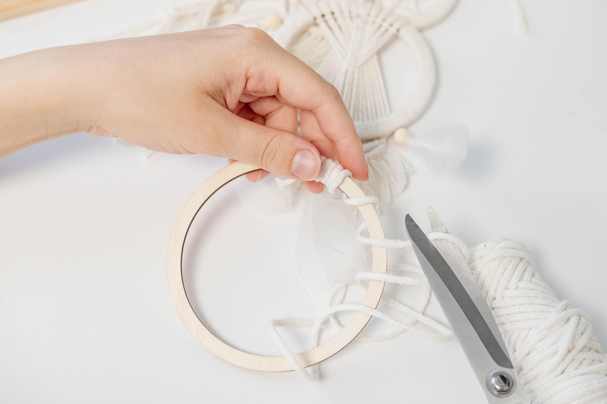 Artisan hands stitching embroidery on hoop